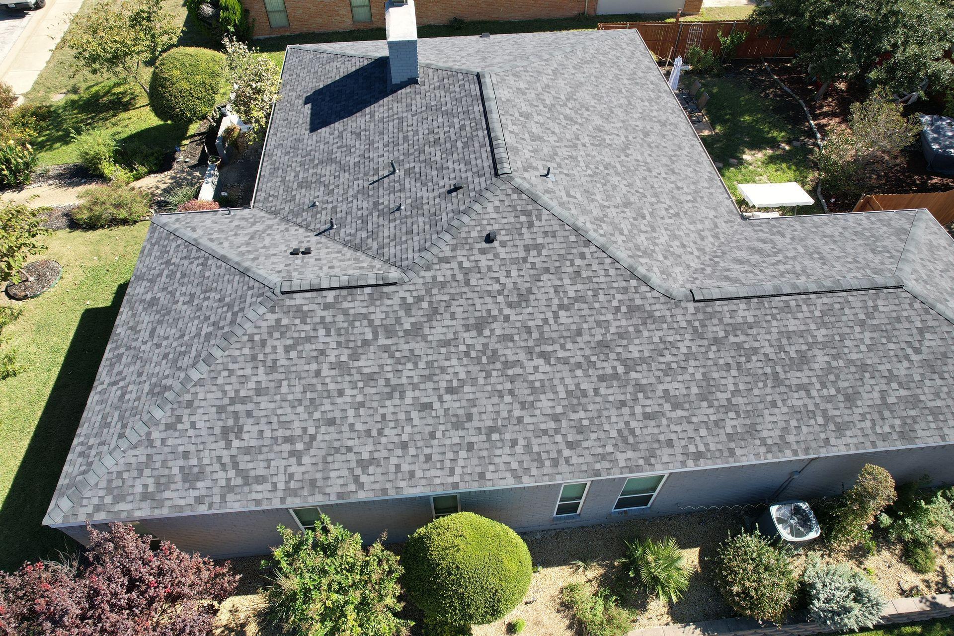 5 Signs You Might Need a New Roof in Dallas-Fort Worth Residential asphalt shingle roof in Dallas-Fort Worth showing signs of wear that may require a professional roof inspection